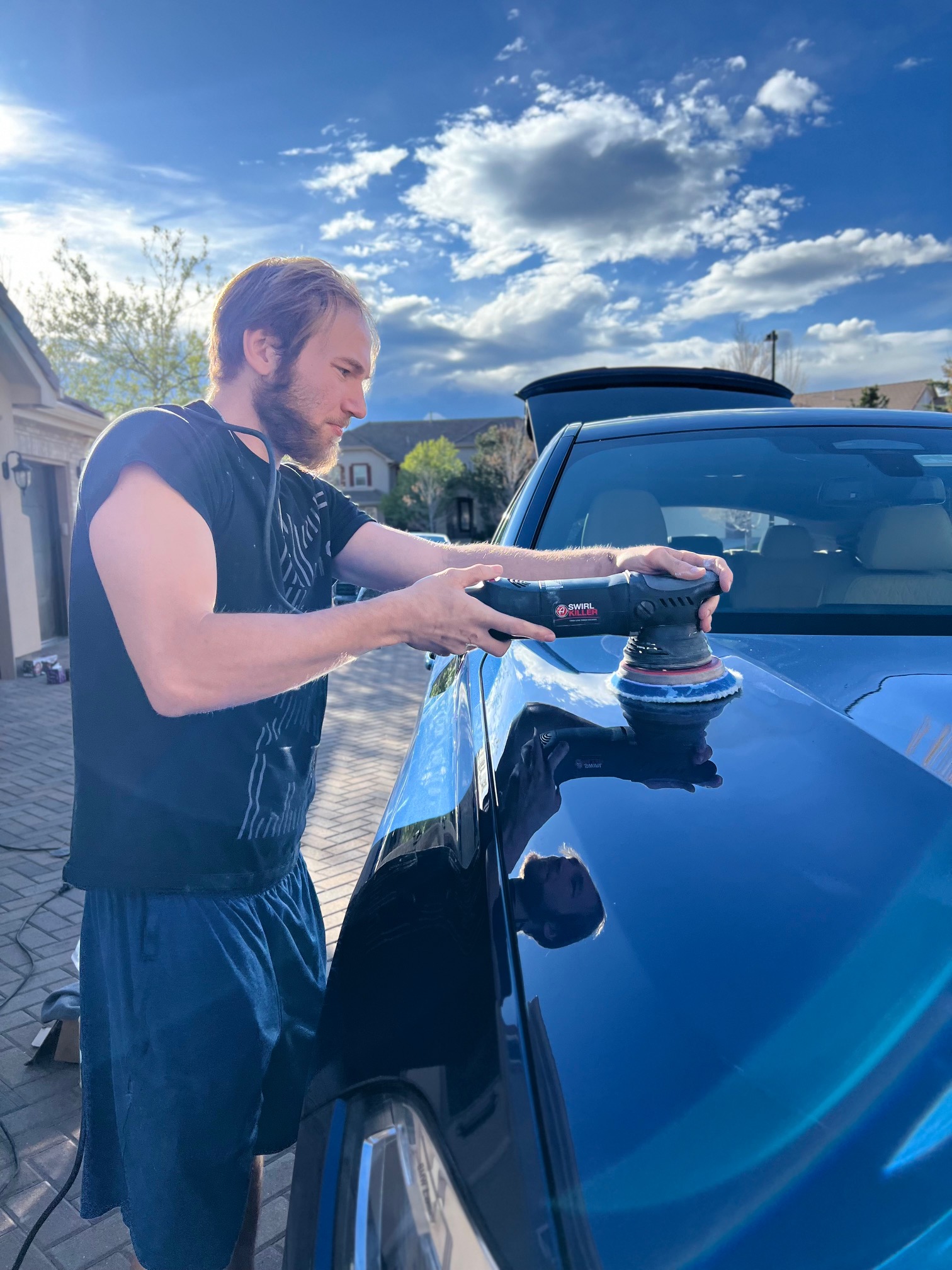 Signature Mobile Detail performing a paint correction/ceramic coating in Denver, Co on a BMW